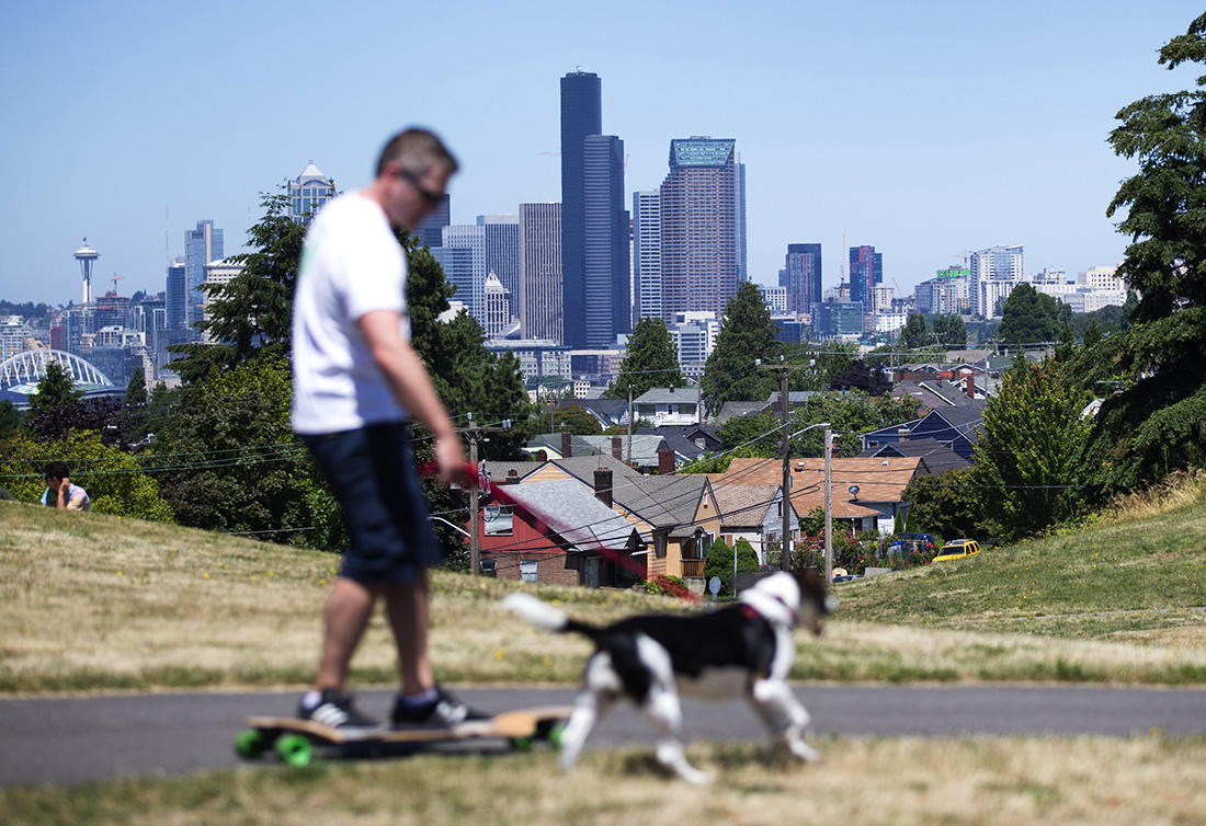 Beacon Hill's Jefferson Park is popular with locals for its large open spaces and spectacular views that include downtown Seattle and the Olympic Mountains. (Lindsey Wasson / The Seattle Times)