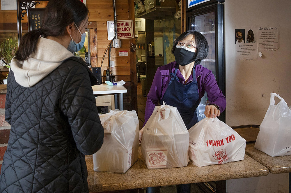 Trinh Ong, owner of Mi La Cay, wondered if she could keep her Vietnamese restaurant going. Its windows were smashed in April 2020 amid a wave of racism against Asian Americans, compounding her worries. (Ellen M. Banner / The Seattle Times)