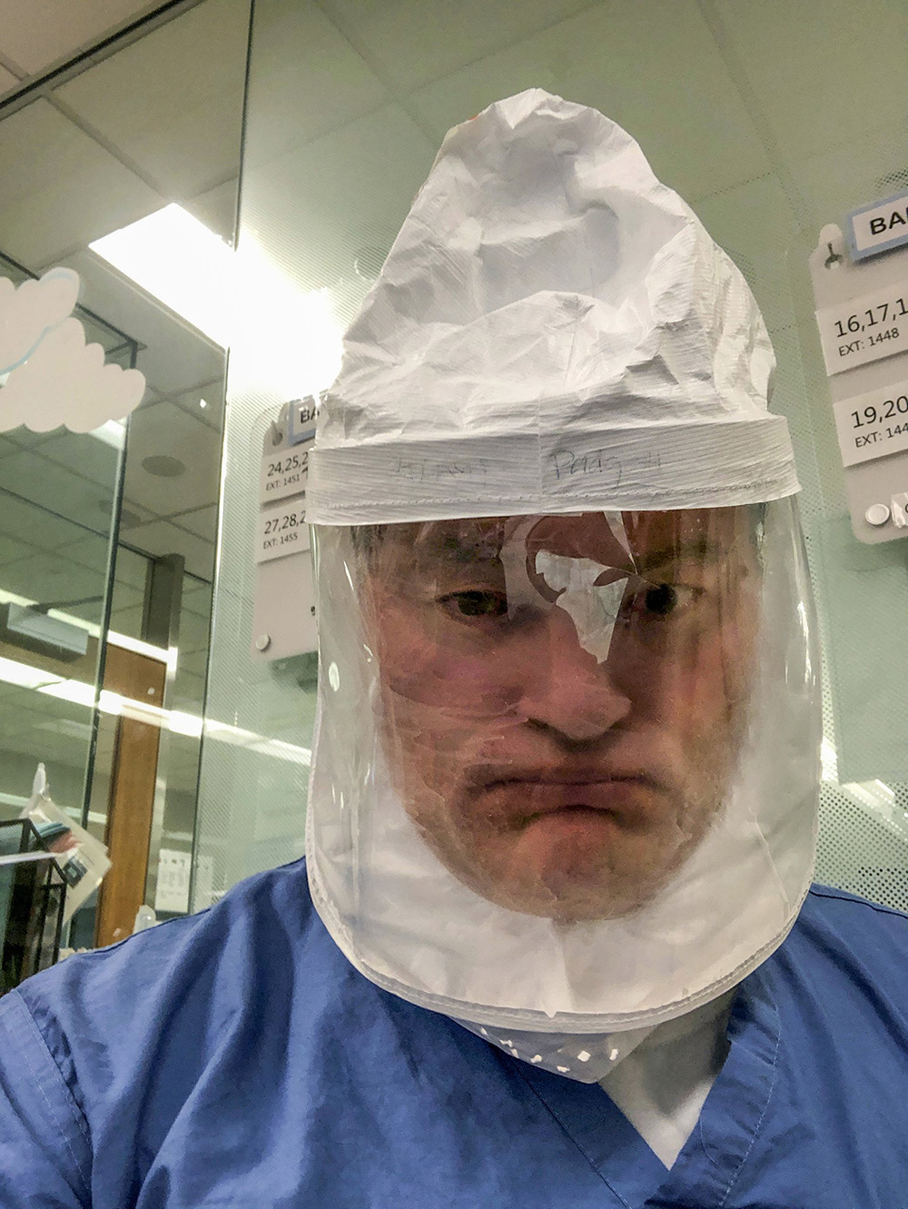 On March 3, 2020, Dr. Ryan Padgett texted friends a selfie in his new protective gear, including an air-purifying system. The next week, the emergency physician would fall ill. (Courtesy of Dr. Ryan Padgett)