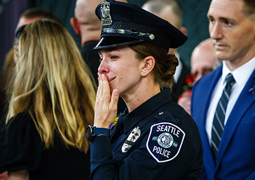One of the hardest things to photograph is a memorial or vigil. We were given permission to photograph the emotional memorial service of police officer Alexandra “Lexi” Harris, who was hit by a driver and killed when she stopped to help at a crash scene. Hundreds of police officers were in attendance at T-Mobile Park to pay respect to Lexi. I respected the family not wanting to be photographed and instead focused on Lexi's co-workers who spoke at the service. Just as the service finished, I saw Seattle Police officer Cali Hinzman overwhelmed with emotion. She was a very close friend of Lexi's, which made the photo all the more moving.