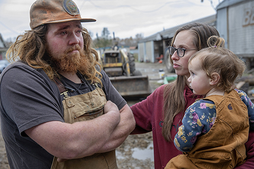 “It was tough to leave them.” That’s what Jordan Baumgardner, left, said of having to abandon his rescue of the family’s dairy cows in the middle of the night as floodwaters became too high and too swift. The animals had been secured on a protected piece of high ground, but when an electric fence shorted out from rising waters, the creatures of habit started returning to their barn for milking. Forty-four perished. Still reeling days later, Baumgardner is consoled by his wife, Jamie, who holds their daughter, Grace, as he recounts venturing into the water that submerged his family’s Mount Vernon dairy farm. I can’t remember another photograph of mine triggering such a significant emotional response from readers, as well as journalists in my own newsroom. I read the emails and online comments with a renewed appreciation of how good photojournalism can spur empathy.