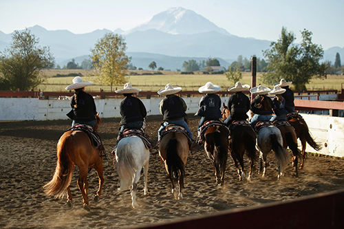 With Mount Rainier in the background, team Escaramuza Erandi warms up for Washington’s first state escaramuza championship in Enumclaw. Escaramuza — a synchronized team equestrian competition choreographed to music — is the only women's event in charrería, Mexico’s national sport. After months of practice, Jessica Paola Pimienta, of Snohomish, and her team, Escaramuza Erandi, earned top honors. The team advanced to Federación Mexicana de Charrería’s national competition in Aguascalientes, Mexico. “Keeping our cultural traditions alive, here, is creating an environment that feels like home,” Pimienta says. “I hope that in the next four years we’re able to raise our voices as women in the sport.
