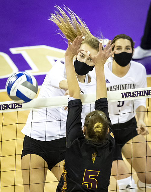 Washington middle blocker Marin Grote gets a kill in the third set as the Huskies defeat Arizona State in four sets. The UW volleyball team played a thrilling season in 2021 to a mostly empty Alaska Airlines Arena. I felt lucky to be one of the only people with a seat to the live action. For many of these games, I roamed the upper tiers of the arena, with the whole place mostly to myself, able to line up shots from wherever the angles looked best. I used a 400 mm prime lens to get a really good, sharp depth-of-field contrast.