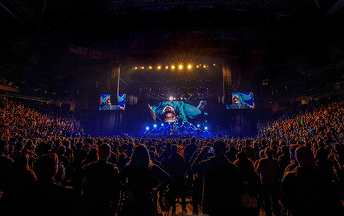 The return to live music for quite a few folks coincided with the opening of the new Climate Pledge Arena. I was assigned to shoot the very first event at the $1.2 billion structure, where Foo Fighters swung their hair back and forth to the delight of the packed house. At concerts, photographers are normally allowed to shoot from only one of two places: in the pit between the stage and general admission, or back near the soundboard. This concert was the latter, with photographers standing on ladders near the back of the house in order to have a view of the stage over a sea of standing people. That gave me the vantage point to take this photo showing part of the new arena, Dave Grohl’s lovely locks and his thousands of backlit admirers.