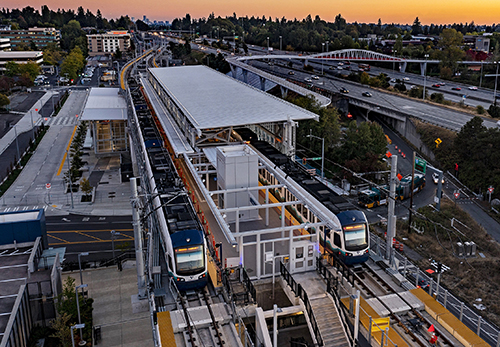 The Northgate light rail station is seen from a drone at sundown, a short while before it would open in October. Seattle Times photographer Ellen M. Banner deserves a lot of credit for this image. We recently had caught up by phone and discussed her latest project: the light rail expansion to Northgate. Ellen felt the photo had to be at sunset, and got a great shot from a difficult vantage point. But I wasn’t completely surprised when I was given a last-minute assignment to take a crack at covering Northgate by air. It was the only way to get a view of the station with the city in the background, which was a big part of the story. In keeping with Ellen’s original vision for a station shot, I purposely decided to fly at sunset. I was so happy when my longtime friend liked the aerial view, which turned out so well because of her original idea.