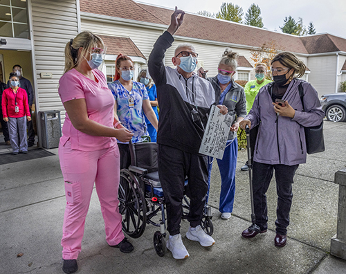 Pastor Hector Garcia points to the sky after being discharged from the Everett Center, a rehabilitation facility. After Garcia battled for his life with COVID-19, I could tell that he was so thankful to God and the staff. Because he is a man of faith and had such a harrowing journey with the virus, this moment portrayed the relief and gratitude he must have felt as he was discharged.