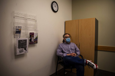 Frank Ford waits for his appointment at Meridian Center For Health on May 21. (Nicole Pasia / Special to The Seattle Times)