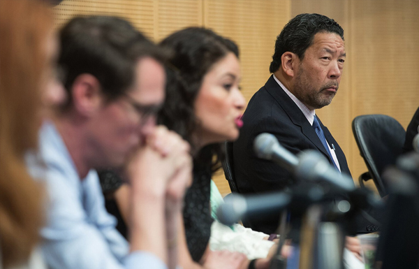 Council President Bruce Harrell, right, listens as M. Lorena González speaks during a council meeting about the head tax June 12, 2018. (Mike Siegel / The Seattle Times)