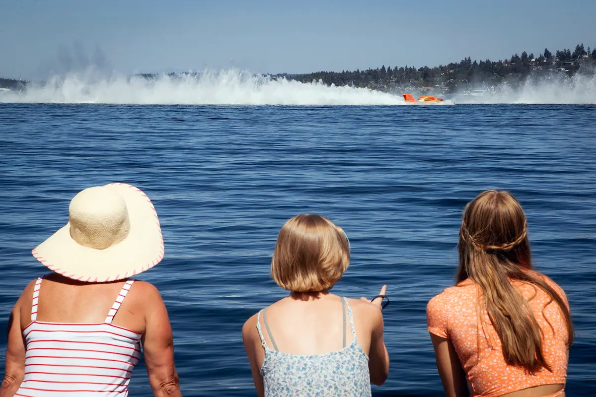 Fans watch the H1 Unlimited Heat 2 hydroplane race during Seafair at Genesee Park and Playfield in Seattle. For the first time since the onset of the COVID-19 pandemic, crowds returned to Lake Washington for the summer event.