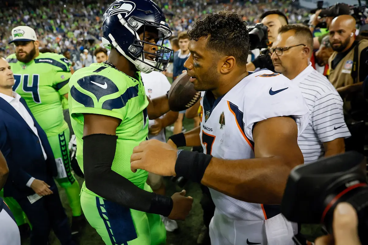 Seahawks quarterback Geno Smith shakes hands with Denver Bronco squarterback Russell Wilson after a 17-16 Seahawks victory in Seattle, a Monday Night Football game that was the season-opener. GE-NO! GE-NO! GE-NO! The chants rang out through a sold-out Lumen Field. The general consensus after Wilson, the Seahawks’ longtime quarterback, had been traded to Denver in a huge offseason deal was that the Seahawks were doomed. How far from the truth that ended up being. Smith has been a wonder. And Wilson and the Broncos are suffering through a terrible season. After the game, all eyes were on Wilson. He exchanged a frosty hug with coach Pete Carroll. No love lost there. And then in came Geno. He was carrying the game ball. They hugged, exchanged pleasantries and parted.