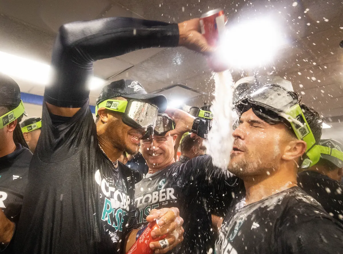 Julio Rodriguez gives Adam Frazier a Champagne bath after the Mariners defeated the Blue Jays,10-9, to sweep an AL wild-card series. The euphoria that came with the Game 2 win was something I hadn’t experienced. And to be invited into the club-house postgame for the Champagne and beer celebration was a career highlight — even if I couldn’t see what I was doing because of all the celebrating. Like the players, I was pretty soaked. But unlike the players, I had to walk back to my hotel covered in booze, freezing, with my hair frozen into a Mohawk.