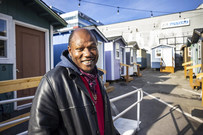 Ira Washington, 46, is moving out of Rosie's Place Tiny House Village and transitioning into a permanent apartment. Before he moved to the village, he spent most of the last two years living in a tent in Licton Springs Park. (Steve Ringman / The Seattle Times)