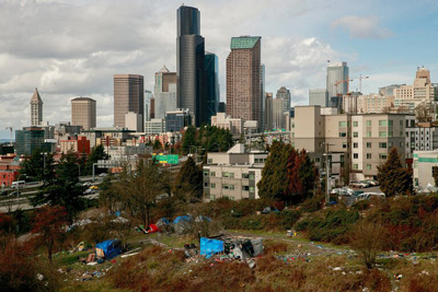Tents and the Seattle skyline can be seen from the Jose Rizal Bridge on Friday.(Erika Schultz / The Seattle Times)