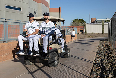 Robbie Ray and Jesse Winker leave a photo shoot for the Seattle Times via golf cart Wednesday. The Seattle Mariners Spring Training camp is being held at the Peoria Sports Complex, in Peoria, AZ, March 16, 2022. 219852 (Dean Rutz / The Seattle Times)