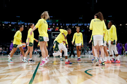 Seattle Storm guard Jewell Loyd pumps up her teammates before the start of a game against the Los Angeles Sparks on April 23 at Climate Pledge Arena in Seattle. (Jennifer Buchanan / The Seattle Times)