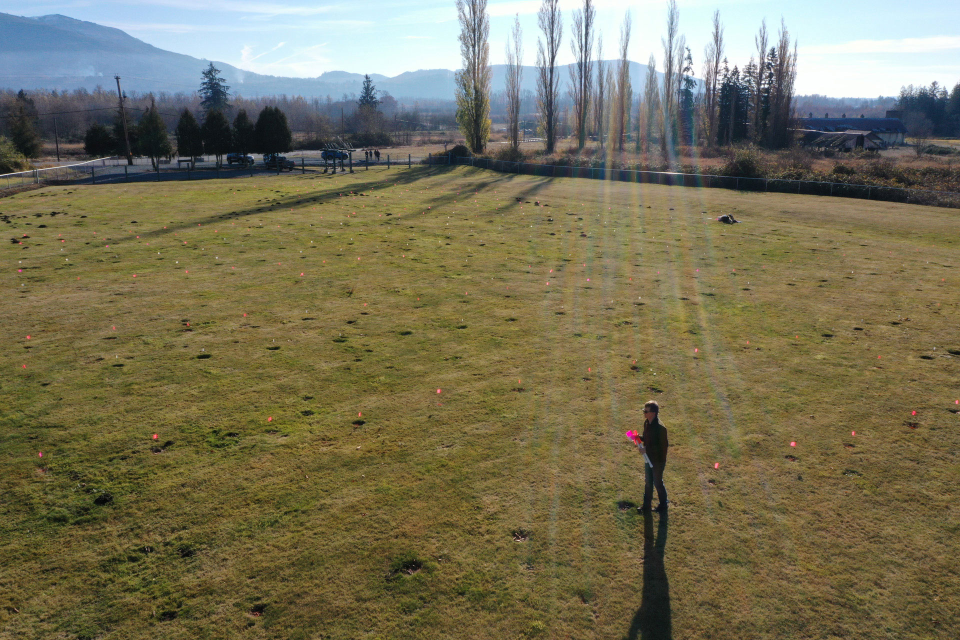 <p>John Horne searches for grave markers at the Northern State Hospital cemetery. He believes at least 200 patients were buried outside the current cemetery’s borders. (Karen Ducey / The Seattle Times, 2022)</p>
