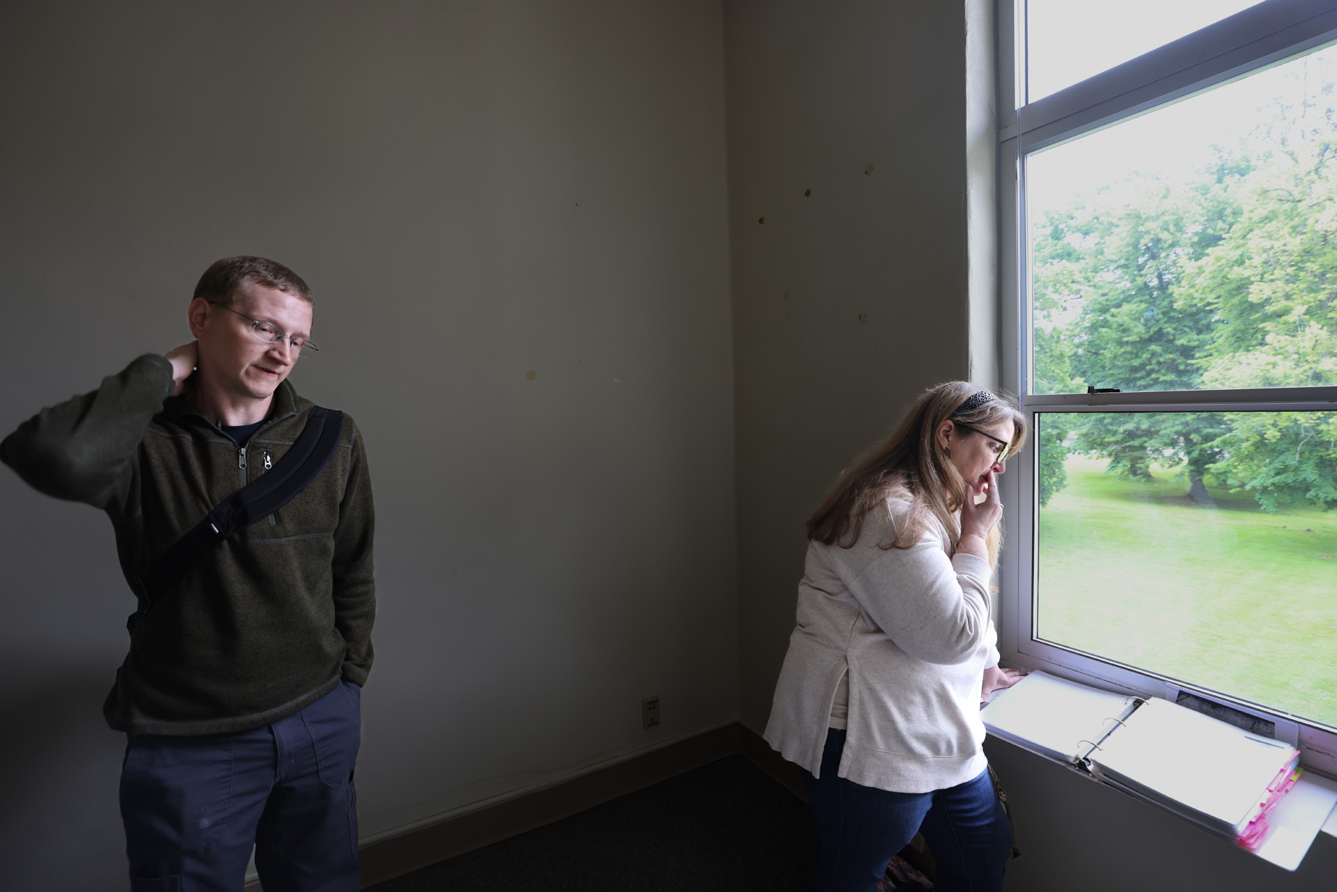 <p>Davidson shows Horne documents naming her great-grandmother while touring the Colman building at Northern State Hospital. (Karen Ducey / The Seattle Times)</p>
